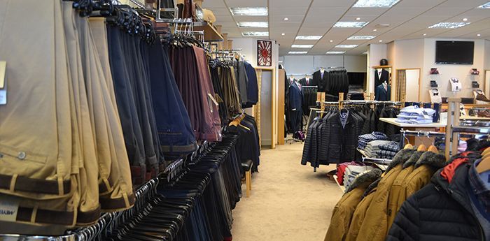 Expert Advice: Inside a full stocked store filled with mens clothes.